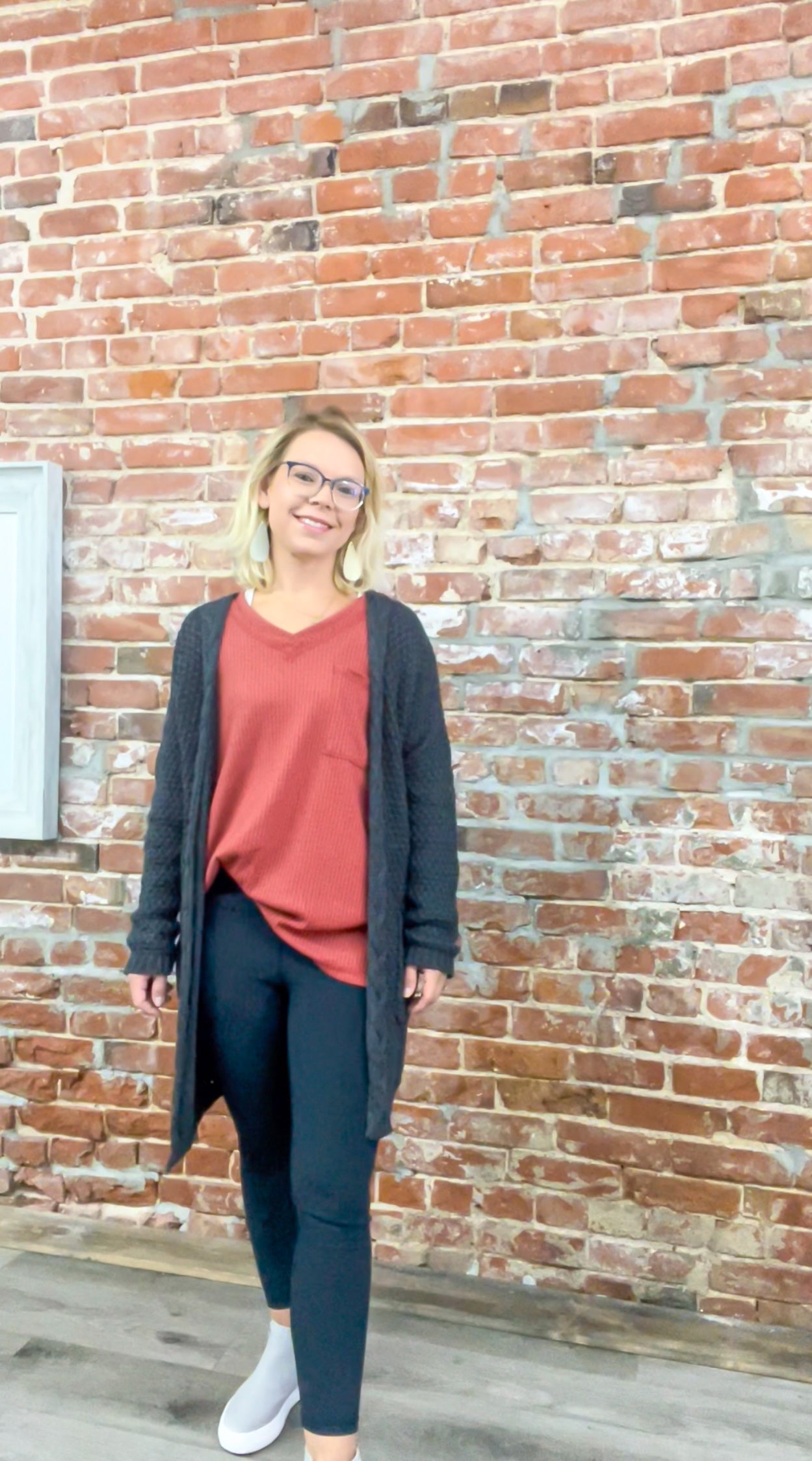 burnt orange waffle knit top paired with cardigan